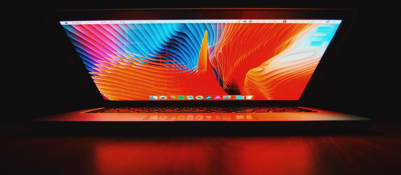 Photo by Yu Kato silver MacBook on brown wooden surface